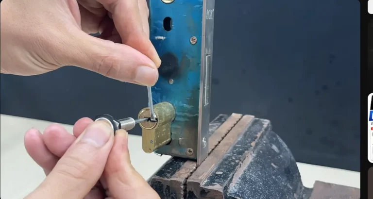 Locksmith cutting and fitting a key